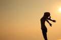 Woman open arms at sunset mountain peak Royalty Free Stock Photo