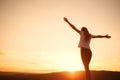 Woman open arms under the sunset. Concept of healthy life. Royalty Free Stock Photo