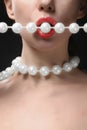 Woman open mouth with pearls