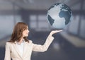 Woman with open palm hand under world earth globe Royalty Free Stock Photo