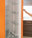 Woman open refrigerator door in the kitchen Royalty Free Stock Photo