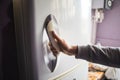 Woman open the refrigerator door Royalty Free Stock Photo