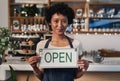 Woman, open sign and portrait in cafe of small business owner or waitress for morning or ready to serve. Female person Royalty Free Stock Photo