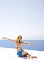 Woman opened her arms to wind and the sea Royalty Free Stock Photo