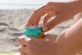 Woman opening aluminum can with beverage on beach, closeup Royalty Free Stock Photo