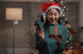 Woman opening a Christmas present box Royalty Free Stock Photo