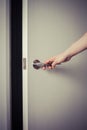 Woman opening a door at night Royalty Free Stock Photo