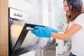 Woman Opening Door Of Oven Full Of Smoke Royalty Free Stock Photo