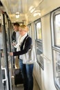 Woman opening the door of train compartment Royalty Free Stock Photo