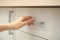 Woman opening drawer at home, closeup view Royalty Free Stock Photo