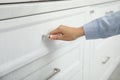 Woman opening drawer at home, closeup view Royalty Free Stock Photo