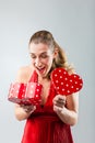 Woman opening the gift and is happy Royalty Free Stock Photo