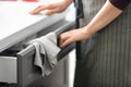 Woman opening kitchen drawer, closeup Royalty Free Stock Photo