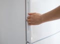 emale hand opening refrigerator Royalty Free Stock Photo