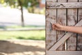 Woman opening old wooden door, closeup Royalty Free Stock Photo