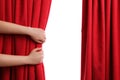 Woman opening red front curtains on white, closeup Royalty Free Stock Photo