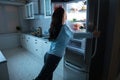 Woman Opening Refrigerator Door Royalty Free Stock Photo