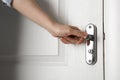 Woman opening white wooden door, closeup Royalty Free Stock Photo