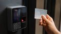 A woman opens the door with a plastic card. Modern keyless entry lock. Royalty Free Stock Photo