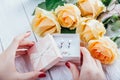 Woman opens a gift box with jewellery Royalty Free Stock Photo