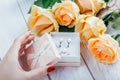 Woman opens a gift box with jewellery Royalty Free Stock Photo