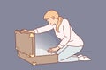 Woman opens large suitcase and sees glow, for concept of discovering treasure with valuables