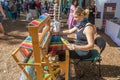 Weaving Loom Operator At Festival.