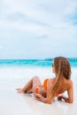 Woman in orange bikini on a tropical beach Royalty Free Stock Photo