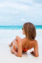 Woman in orange bikini on a tropical beach Royalty Free Stock Photo