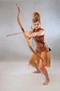 Woman in orange and brown outfit, warrior, fashion