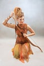 Woman in orange and brown outfit, warrior, fashion, studio