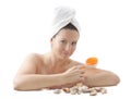 Woman with orange brush for spa-procedures