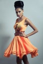 Woman in orange flared dress