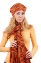 Woman in orange knitted hat, scar and sweater