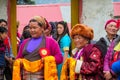 Woman orange scarf at celebration ceremony in Nepal