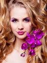 Woman with an orchid Royalty Free Stock Photo