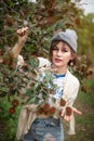 Woman with organic rambutan fruit in orchard