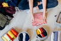 Woman folding pile of clothes on the floor, organizing stuff Royalty Free Stock Photo