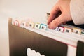 Woman Organizing Documents in a 12-Month Accordion File Organizer