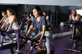Woman and other females working out in club Royalty Free Stock Photo