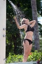 Woman in the outdoor shower Royalty Free Stock Photo