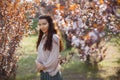 Woman Outdoors in Park Near Spring Blossom Tree Royalty Free Stock Photo