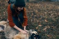 woman outdoors playing with dog friendship travel