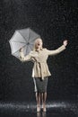 Woman In Overcoat With Umbrella Enjoying The Rain