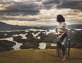 Woman overlooking Ta Dung lake. Panorama landscape