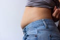 Woman with overweight abdomen. hand holding excessive fat belly Royalty Free Stock Photo