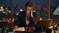 Woman overwork late office typing laptop. Busy manager analysing papers report Royalty Free Stock Photo