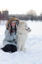 Woman owner hugging white Samoyed dog Royalty Free Stock Photo