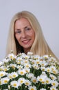 Woman with oxeye daisy flowers