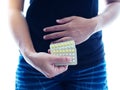 Woman with pack of tablets in hand, Contraceptive pill or birth control pills of women